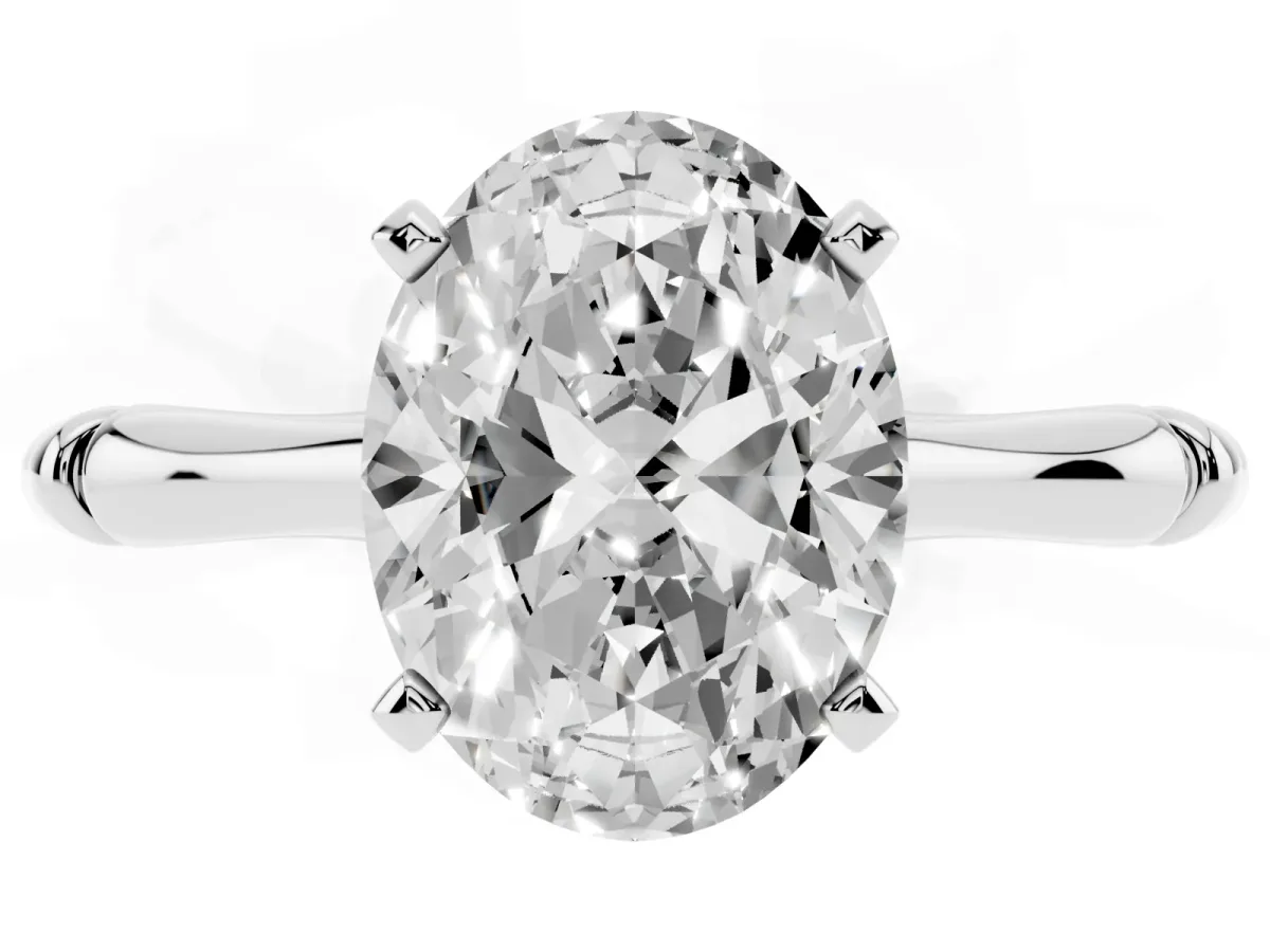 Oval Cut Solitaire Diamond Ring with Bamboo Band and Four-Prong Setting Silver