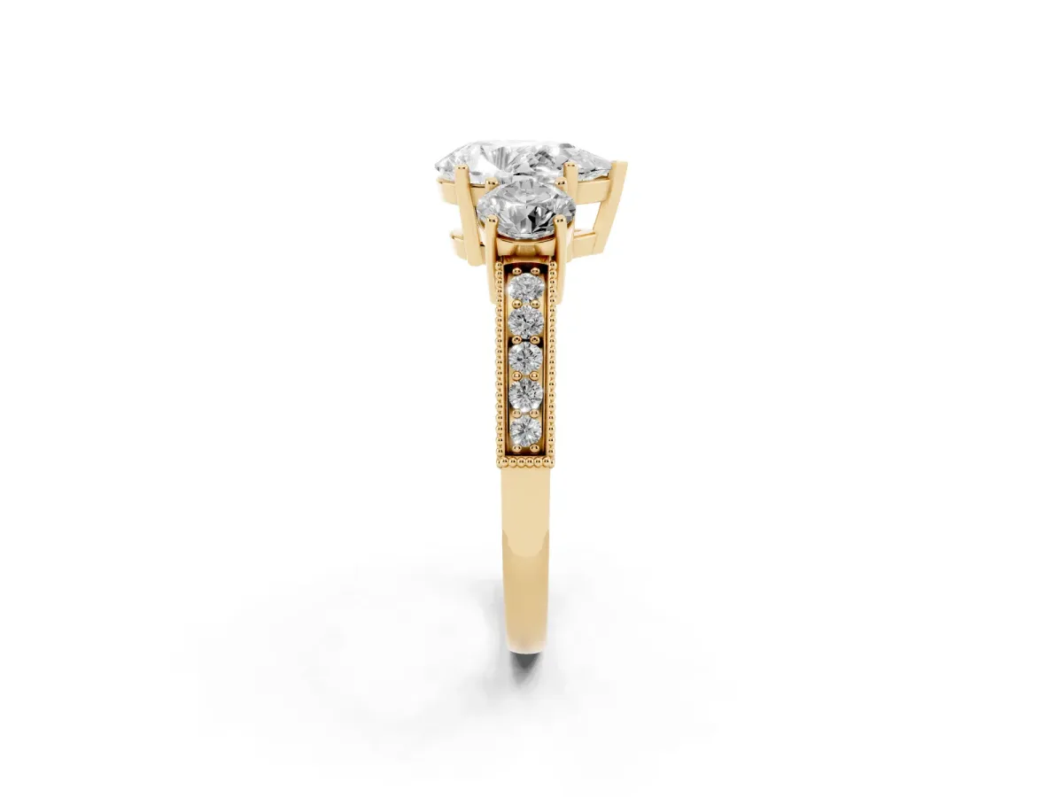 Pear Cut Three-Stone Diamond Ring with Pavé Band and Four-Prong Setting Yellow gold