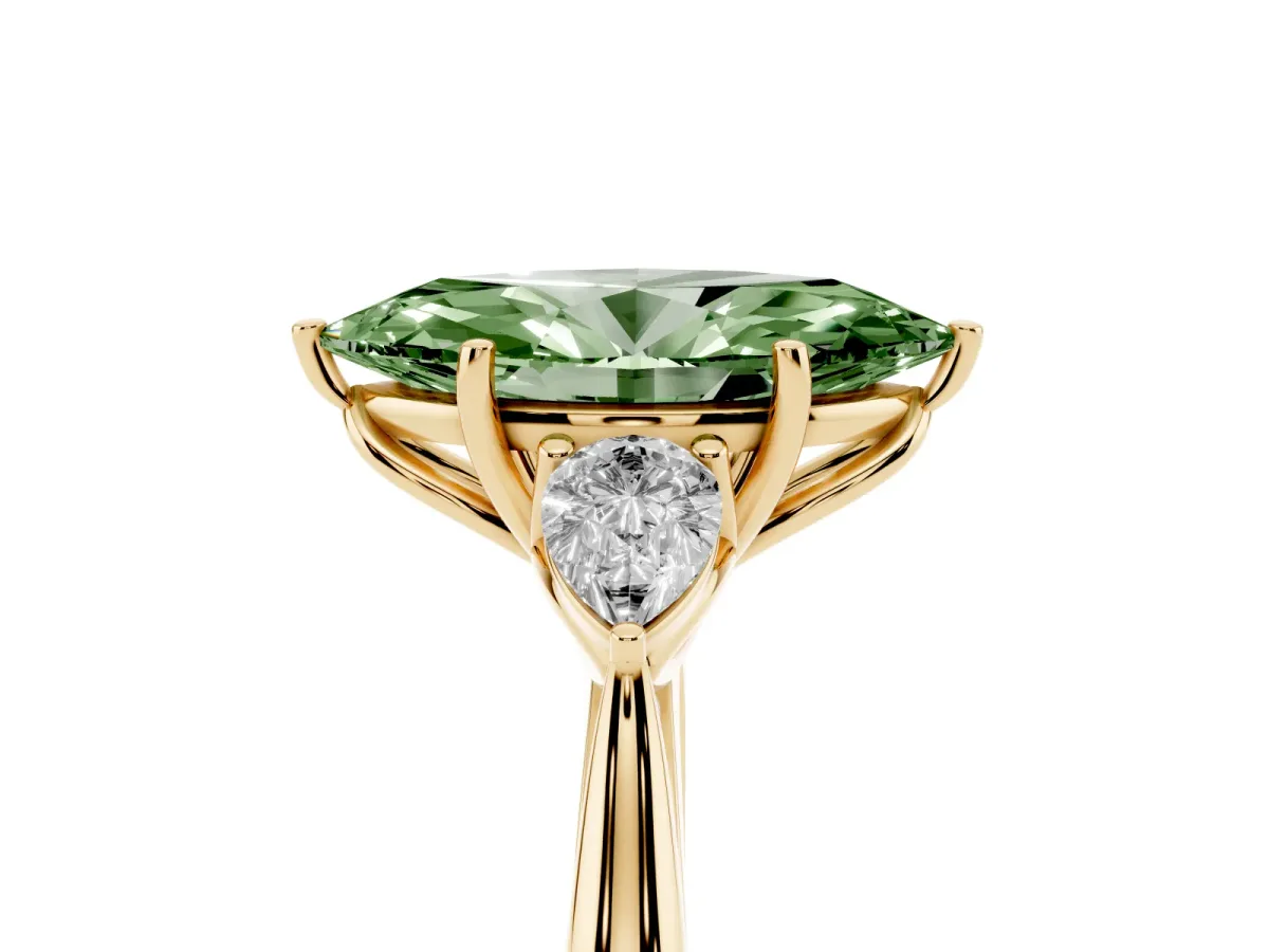 Fancy Green Three-Stone Marquise Cut Diamond Ring with Pear Side Stones in Four-Prong Setting Yellow gold