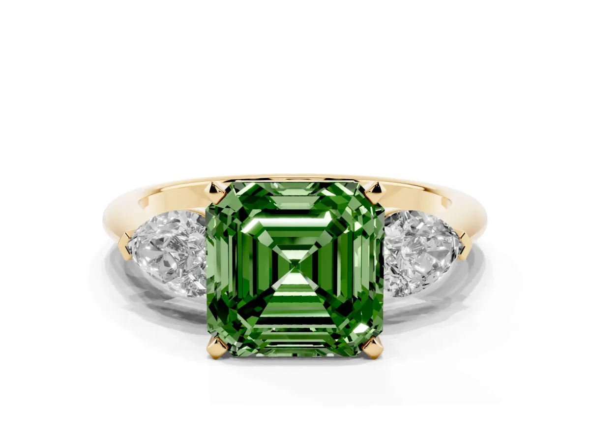 Fancy Green Three-Stone Asscher Cut Diamond Ring with Pear Side Stones and Four-Prong Setting Yellow gold