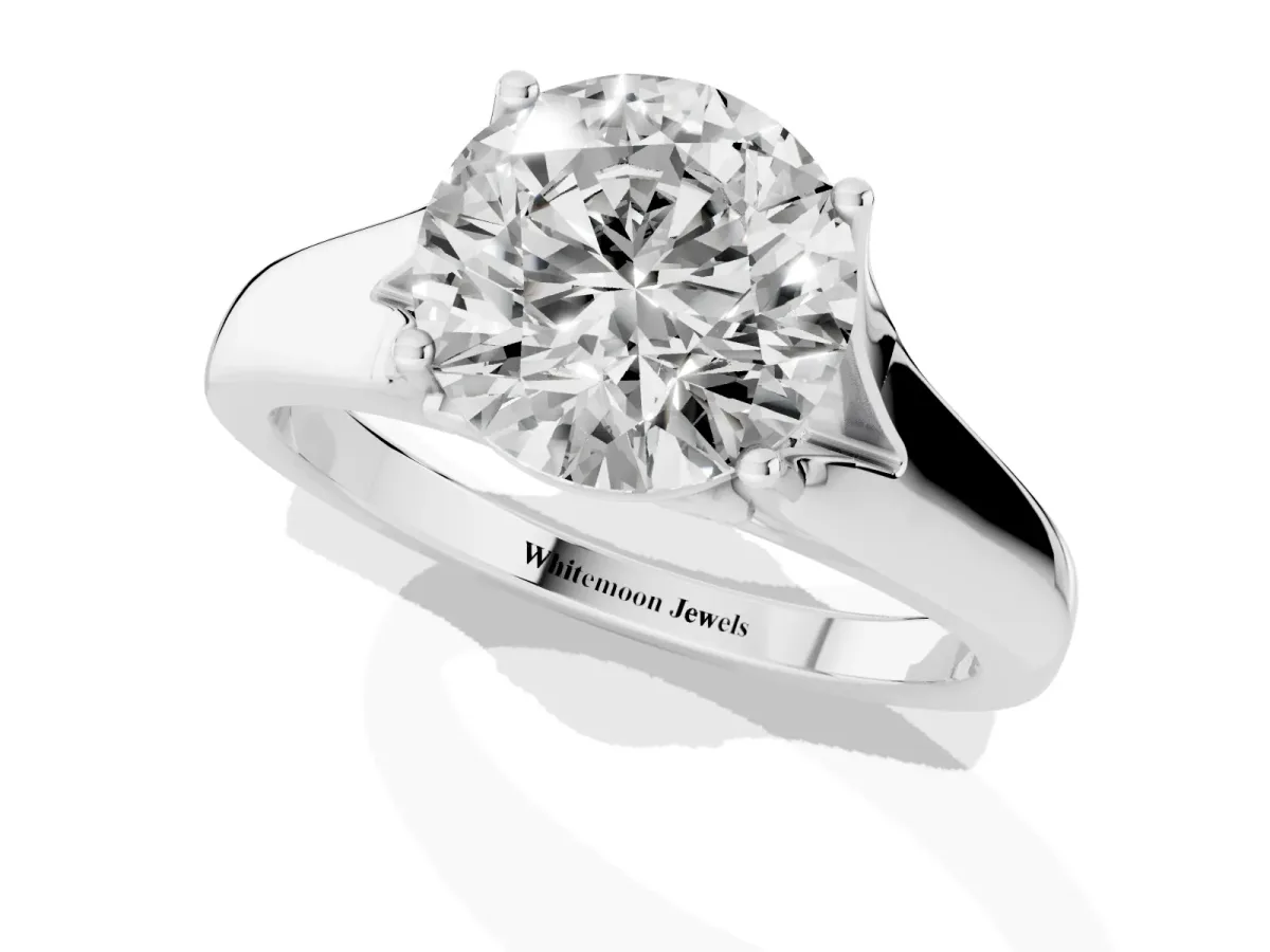 Round Cut Solitaire Diamond Ring with Cathedral Band and Four-Prong Setting Platinum