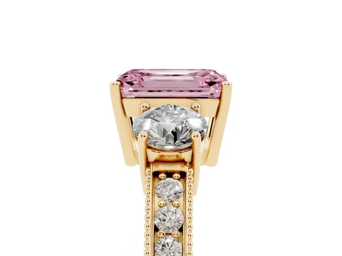 Fancy Pink Emerald Cut Three-Stone Diamond Ring with Pavé Band and Four-Prong Setting Yellow gold