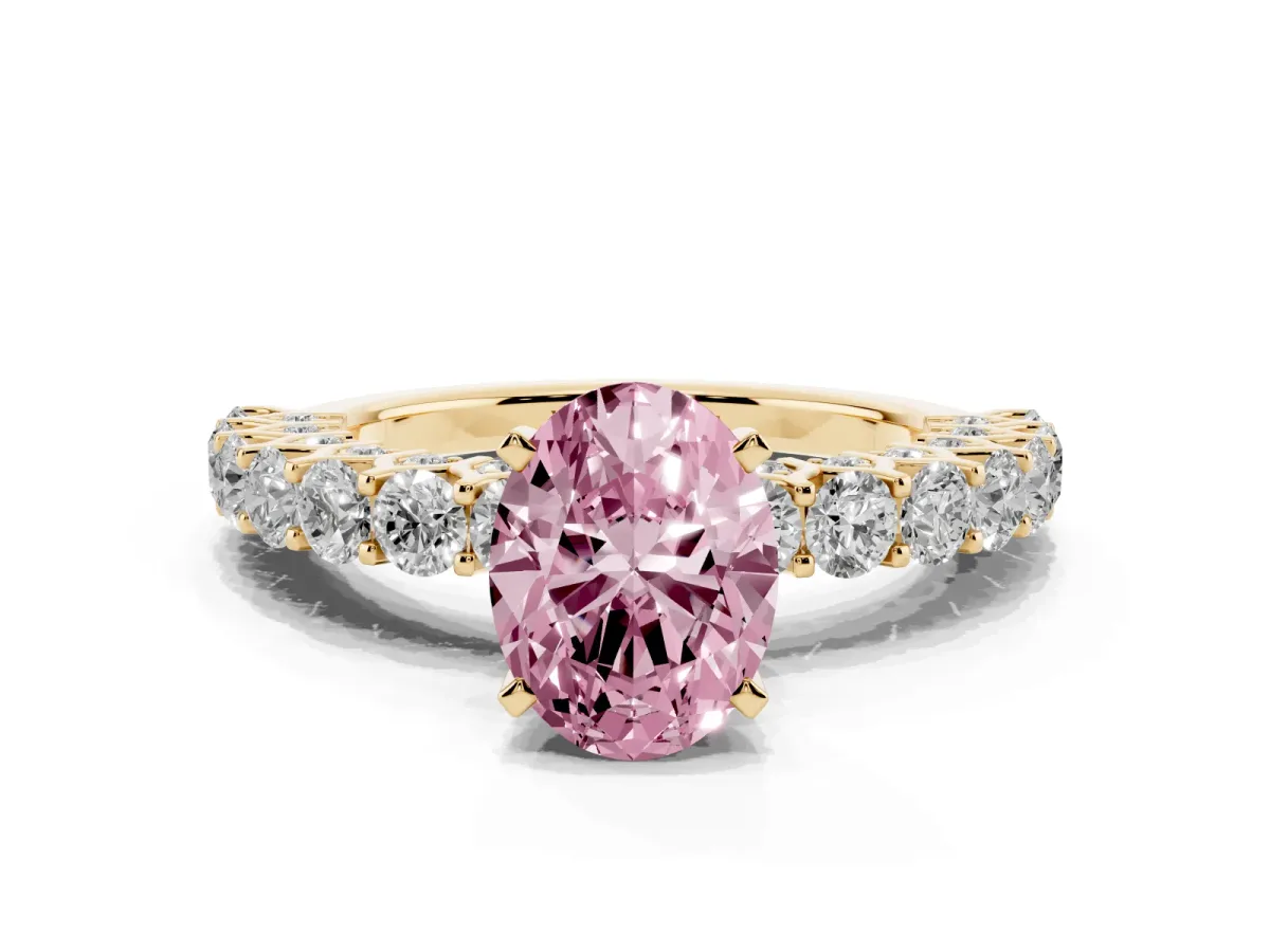 Fancy Pink Oval Cut Diamond Solitaire Ring with Shared Prong Pavé Band and Four-Prong Setting Yellow gold