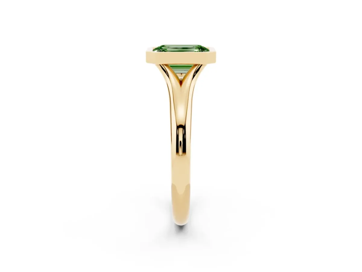 Fancy Green Bezel Set Emerald Cut Solitaire Diamond Ring with Smooth Band Yellow gold