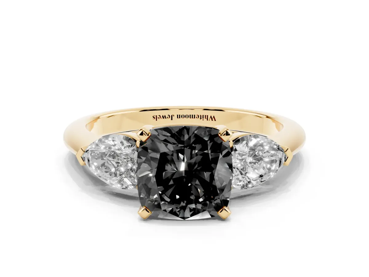 Fancy Black Three-Stone Cushion Cut Diamond Ring with Pear Side Stones and Four-Prong Setting Yellow gold