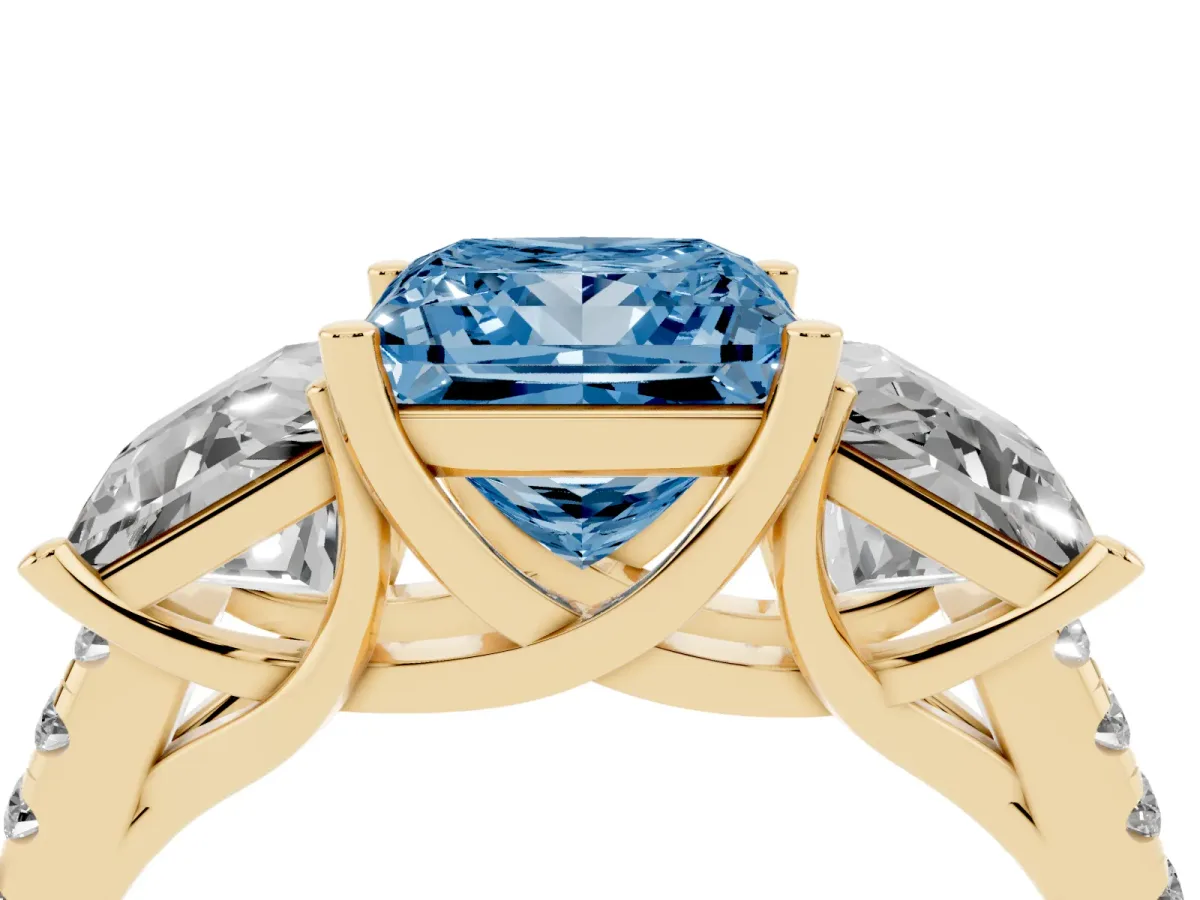 Fancy Blue Three-Stone Princess Cut Diamond Ring with Round Pavé Band and Prong Setting Yellow gold