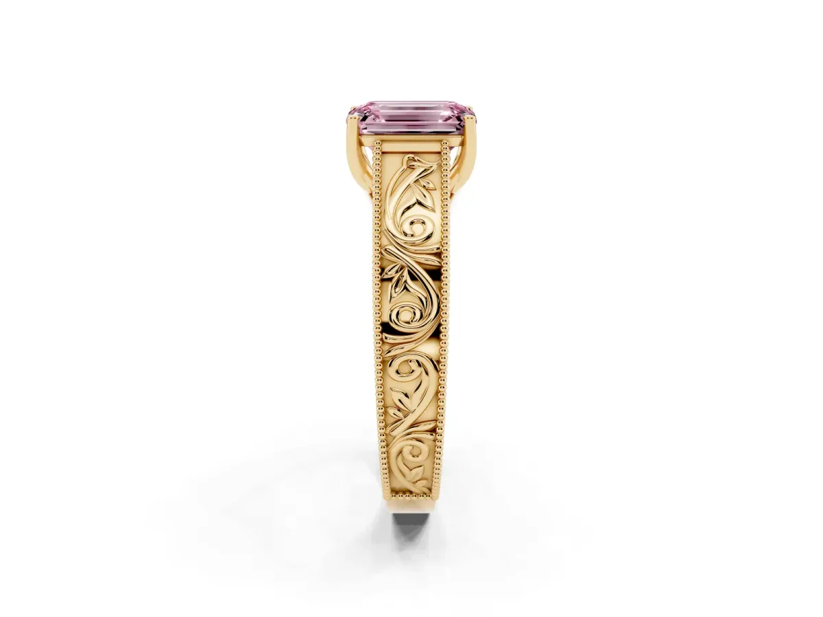 Fancy Pink Emerald Cut Diamond Solitaire Ring with Engraved Band and Four-Prong Setting Yellow gold