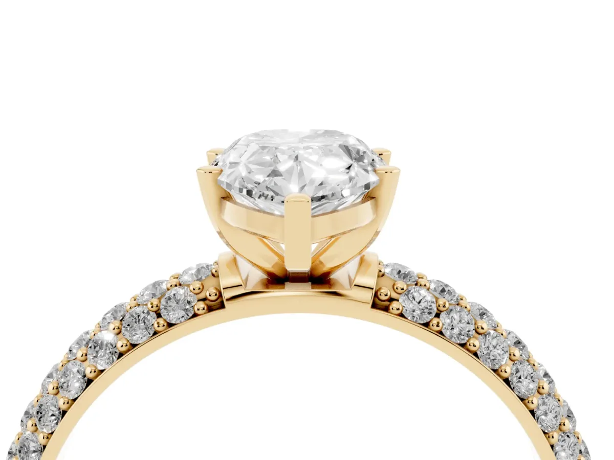 Pear Cut Diamond Solitaire Ring with Prong Setting and Pavé Band Yellow gold