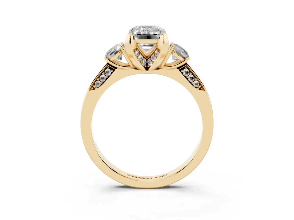 Fancy Black Emerald Cut Brilliant Three-Stone Diamond Ring with Pavé Band and Four-Prong Setting Yellow gold