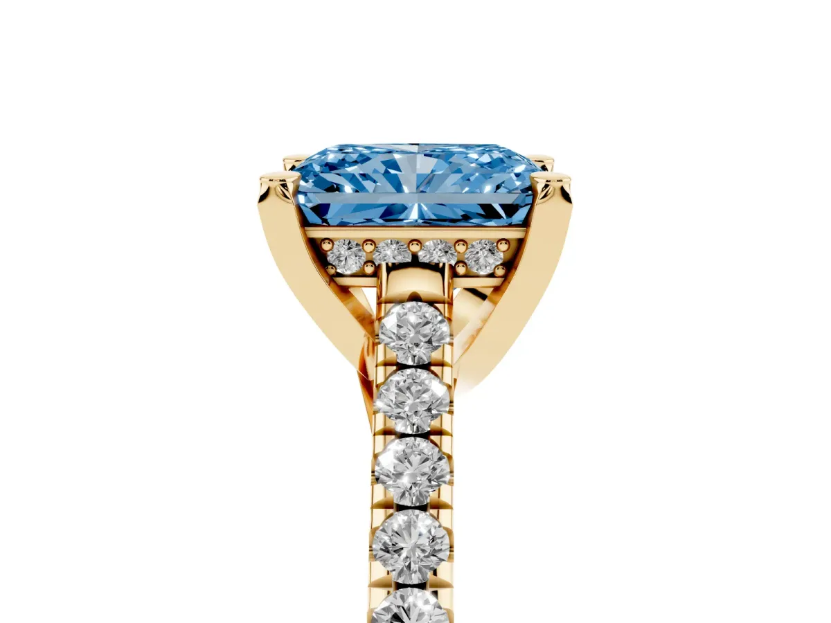 Fancy Blue Radiant Cut Brilliant Diamond Solitaire with Pavé Band and Four-Prong Setting Yellow gold