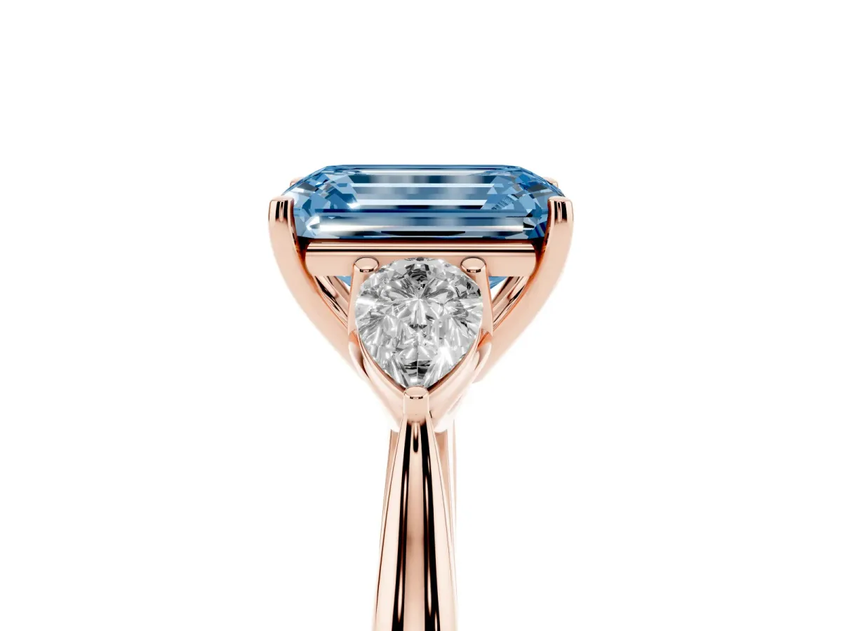 Fancy Blue Emerald Cut Diamond Three-Stone Ring with Pear Side Stones and Prong Setting Rose gold