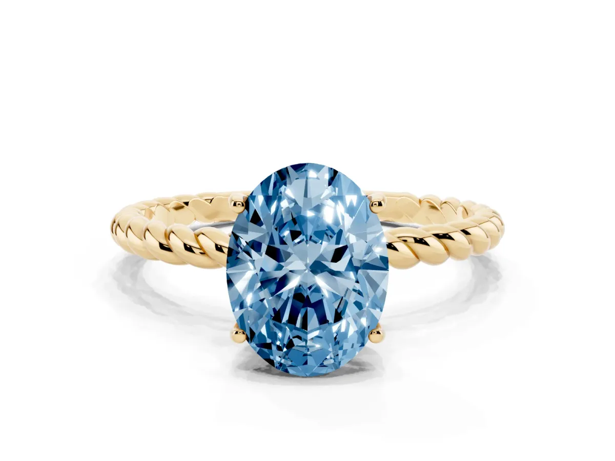 Fancy Blue Oval Cut Solitaire Twist Band Ring with Four-Prong Setting Yellow gold