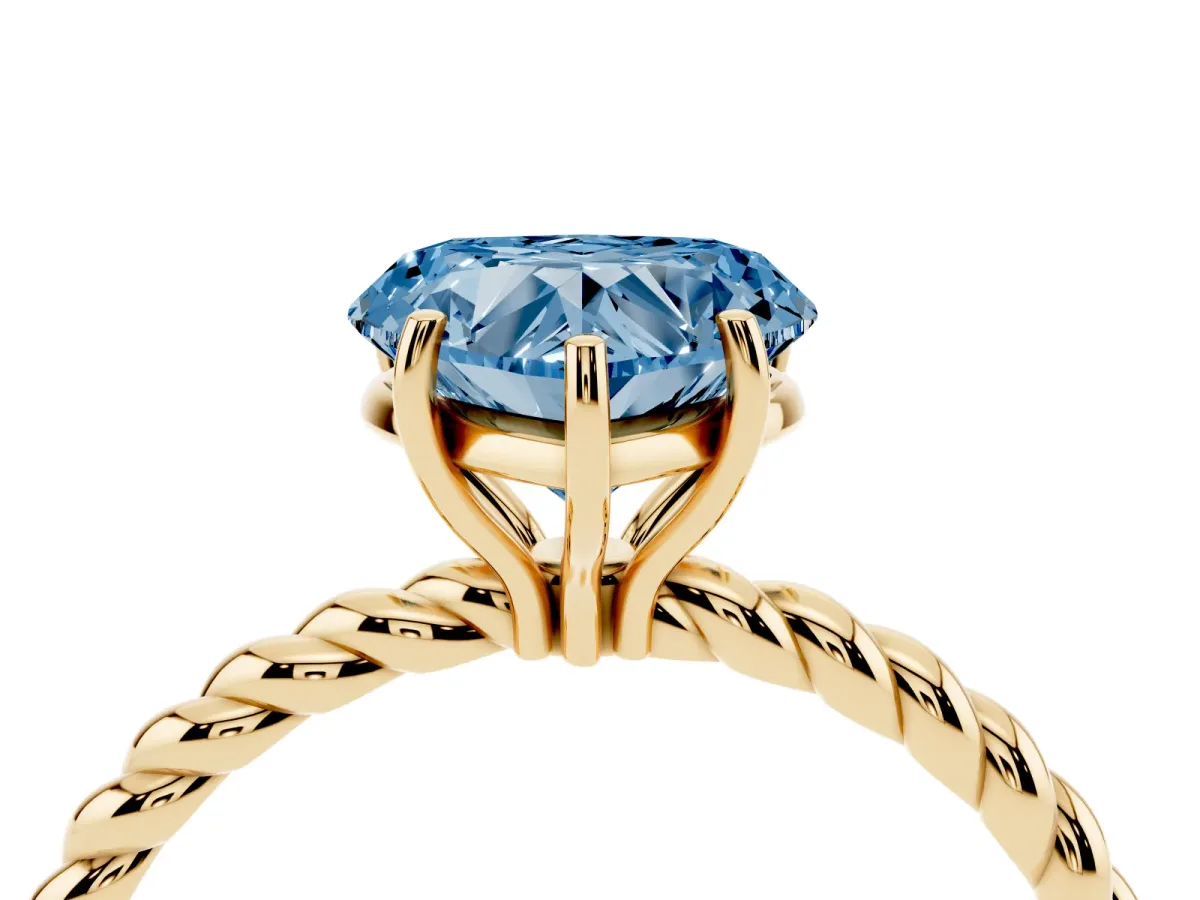 Fancy Blue Heart Cut Solitaire Twist Band Ring with Four-Prong Setting Yellow gold