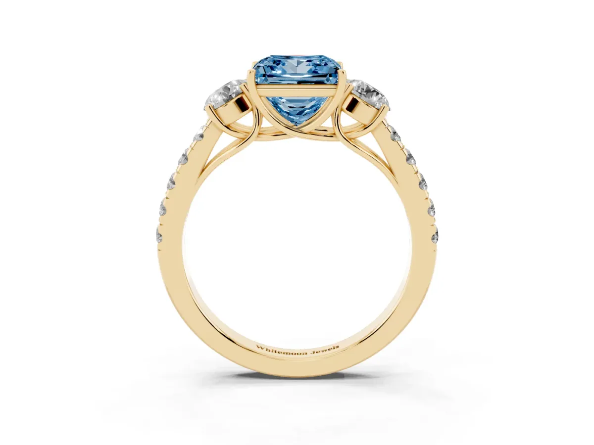 Fancy Blue Princess Cut Cut Diamond Three-Stone Ring with Round Side Stones and Pavé Band Yellow gold