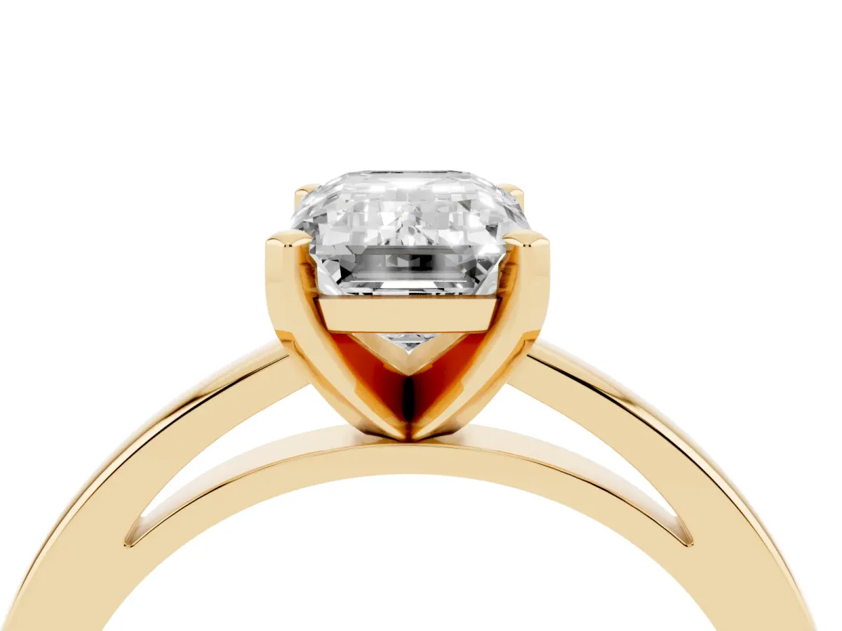 Emerald Cut Solitaire Diamond Engagement Ring with Four-Prong Setting on a Classic Band Yellow gold