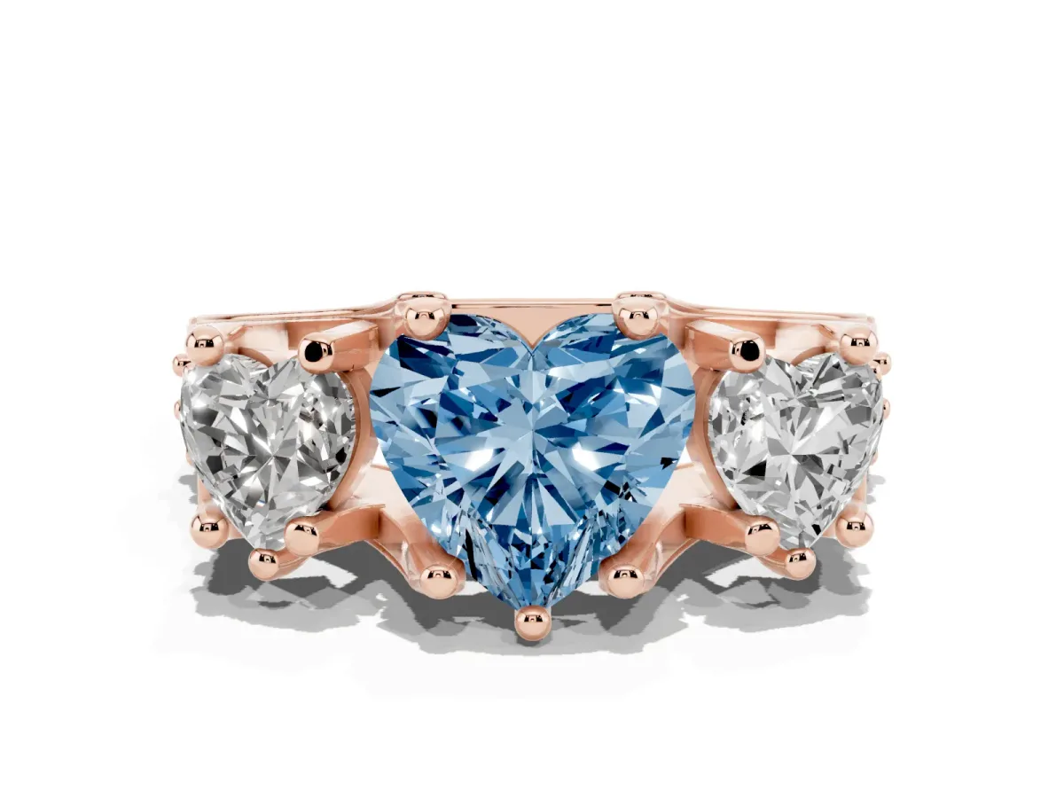 Fancy Blue Heart Cut Diamond Three-Stone Ring with Channel Set Band and Four-Prong Setting Rose gold