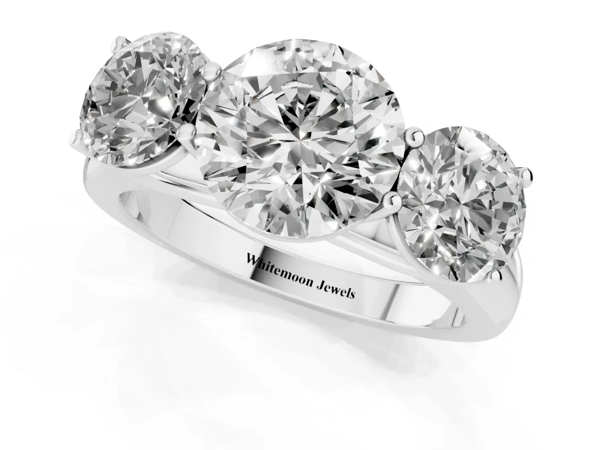 Round Cut Three-Stone Diamond Ring with Prong Setting on a Classic Band Platinum