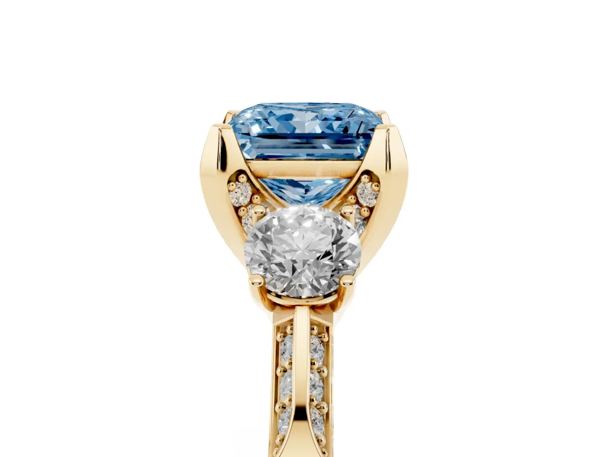 Fancy Blue Princess Cut Brilliant Three-Stone Diamond Ring with Pavé Band and Four-Prong Setting Yellow gold
