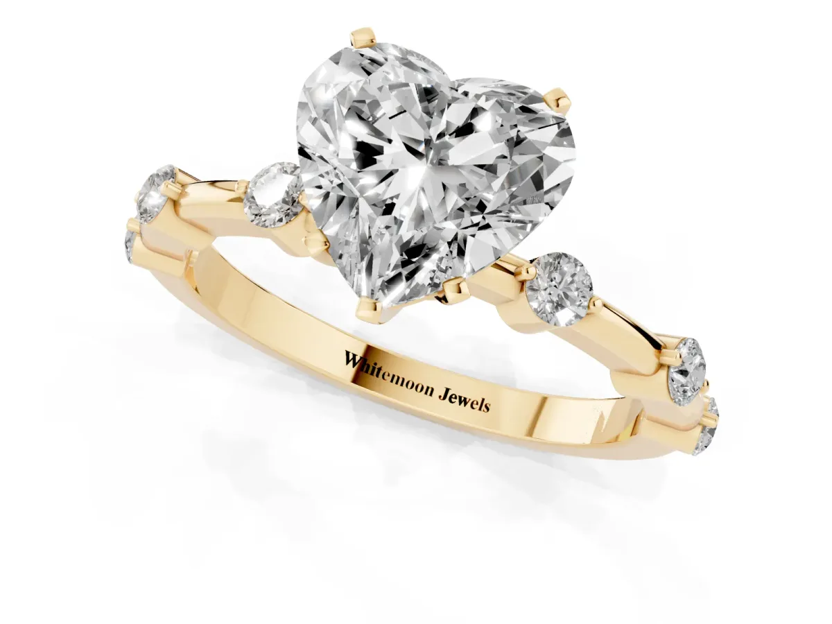 Heart Cut Solitaire Diamond Ring with Bezel Set Side Stones and Prong Setting Yellow gold