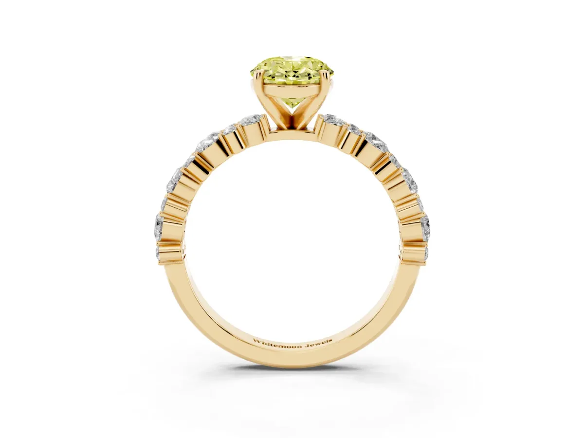 Fancy Yellow Oval Cut Diamond Side Stone Solitaire Ring with Round and Four-Prong Setting Yellow gold