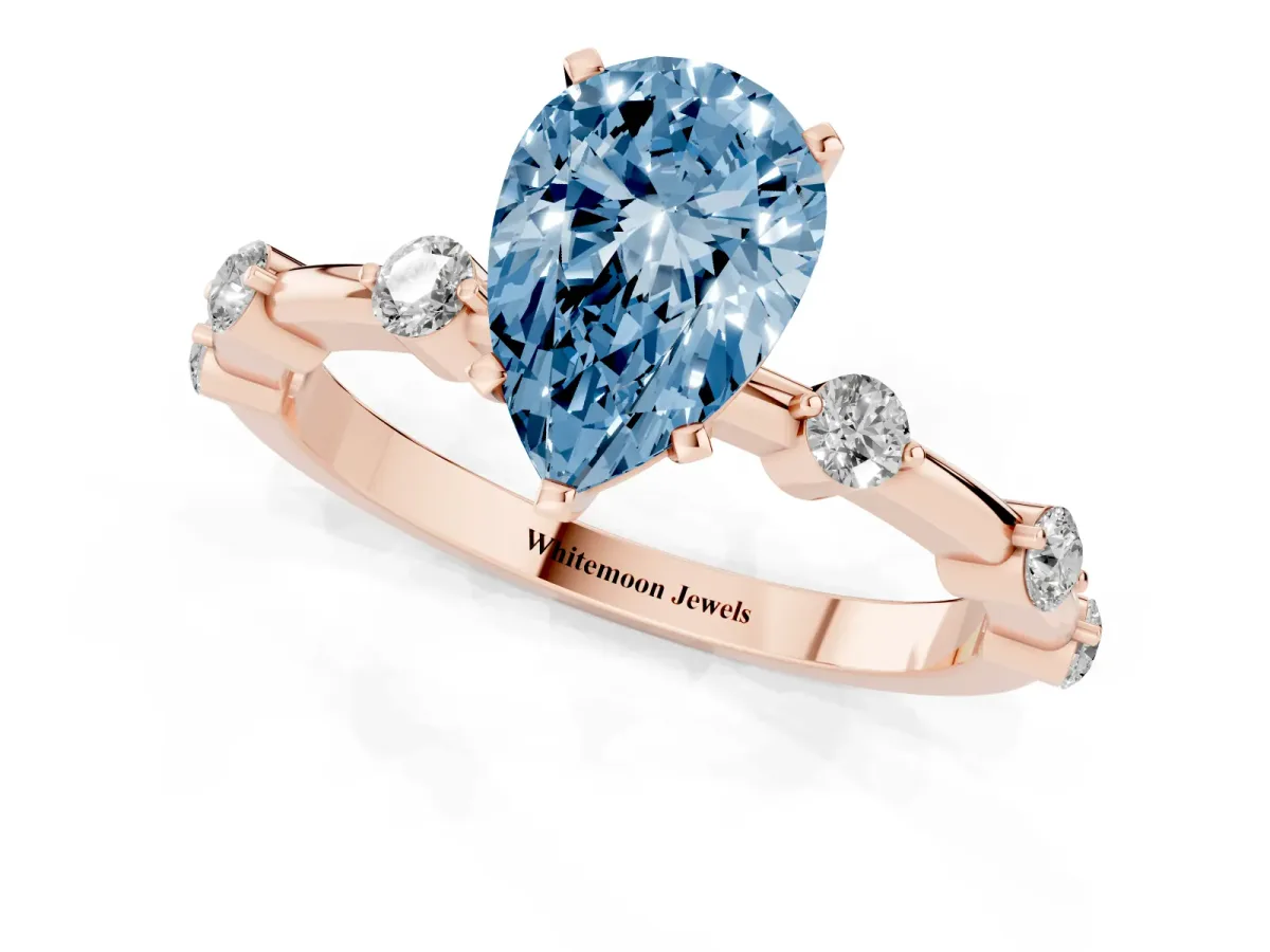 Fancy Blue Pear Cut Solitaire Diamond Ring with Bezel Set Side Stones and Prong Setting Rose gold