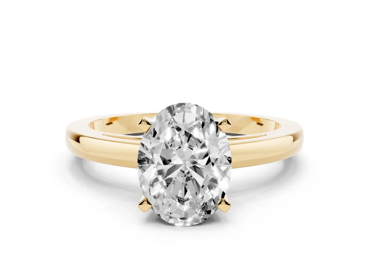 Oval Cut Solitaire Diamond Engagement Ring with Four-Prong Setting on a Classic Band Yellow gold