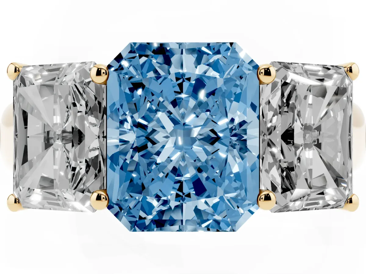 Fancy Blue Radiant Cut Three-Stone Diamond Ring with Prong Setting on a Classic Band Yellow gold