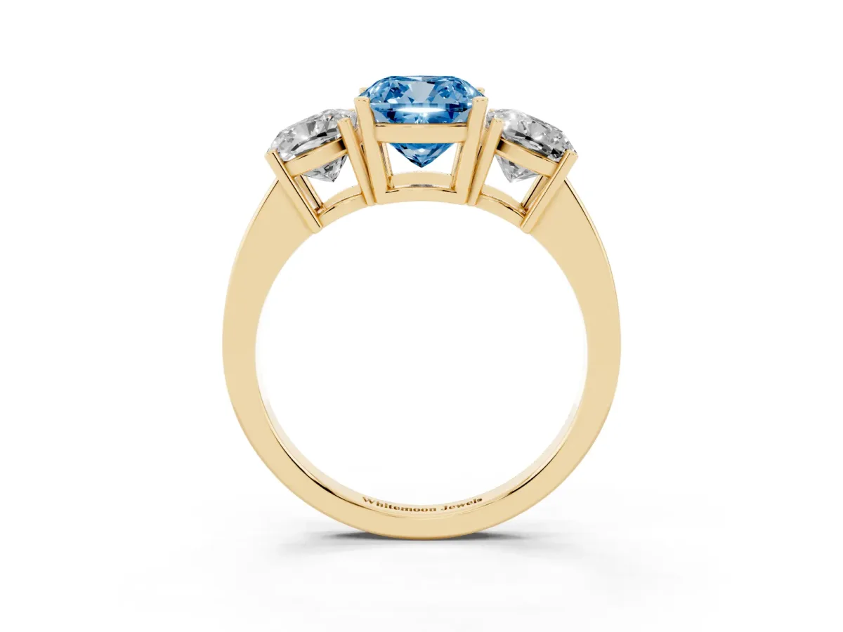 Fancy Blue Three-Stone Cushion Cut Cut Diamond Engagement Ring with Flat Band and Four-Prong Setting Yellow gold