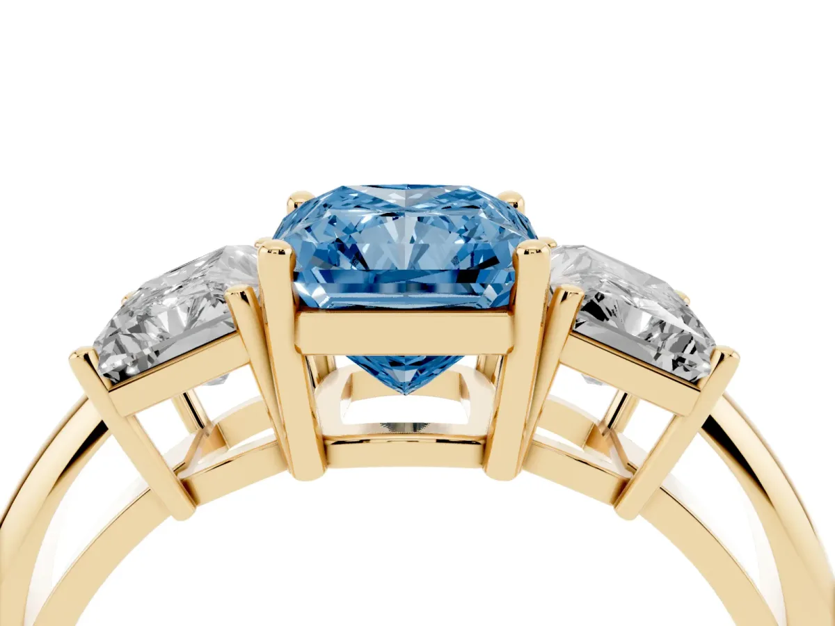 Fancy Blue Three-Stone Radiant Cut Cut Diamond Engagement Ring with Prong Setting on a White Gold Band Yellow gold