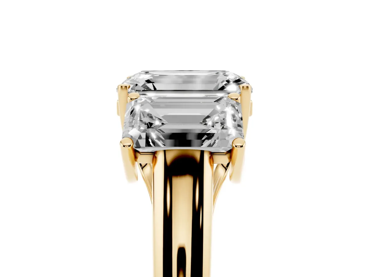 Three-Stone Emerald Cut Diamond Engagement Ring with Prong Setting Yellow gold