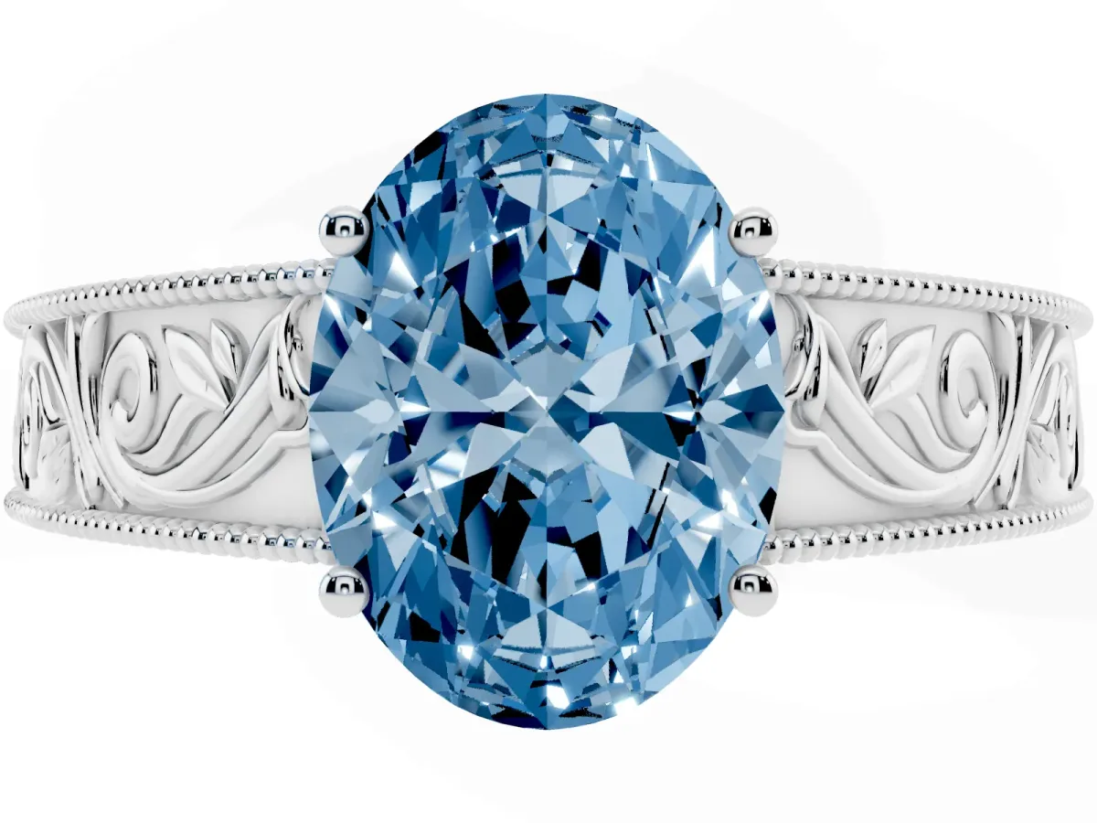 Fancy Blue Oval Cut Diamond Solitaire Ring with Engraved Band and Four-Prong Setting Silver