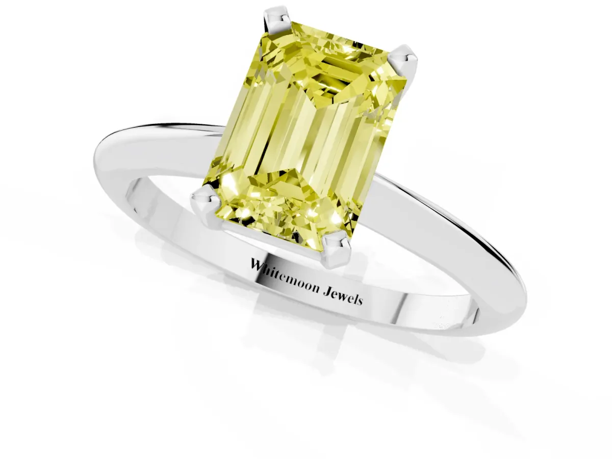 Fancy Yellow Emerald Cut Cut Solitaire Ring with Four-Prong Setting on a Classic Band Silver
