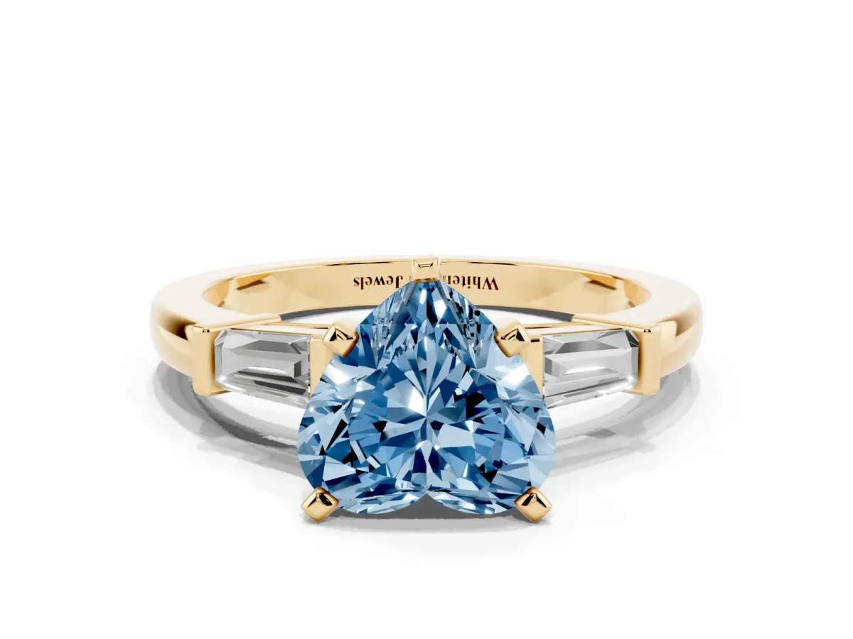 Fancy Blue Heart Cut Cut Diamond Solitaire Ring with Tapered Baguette Accents and Four-Prong Setting Yellow gold
