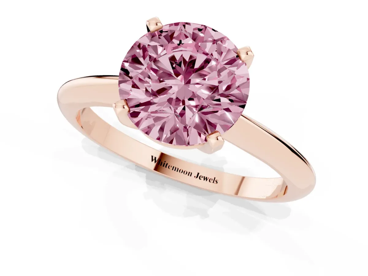 Fancy Pink Round Cut Cut Solitaire Ring with Four-Prong Setting on a Classic Band Rose gold