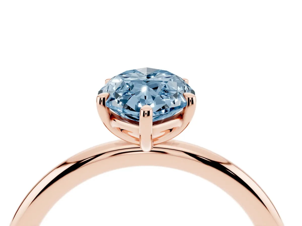 Fancy Blue Oval Cut Solitaire Diamond Ring with Four-Prong Setting on a Plain Band Rose gold
