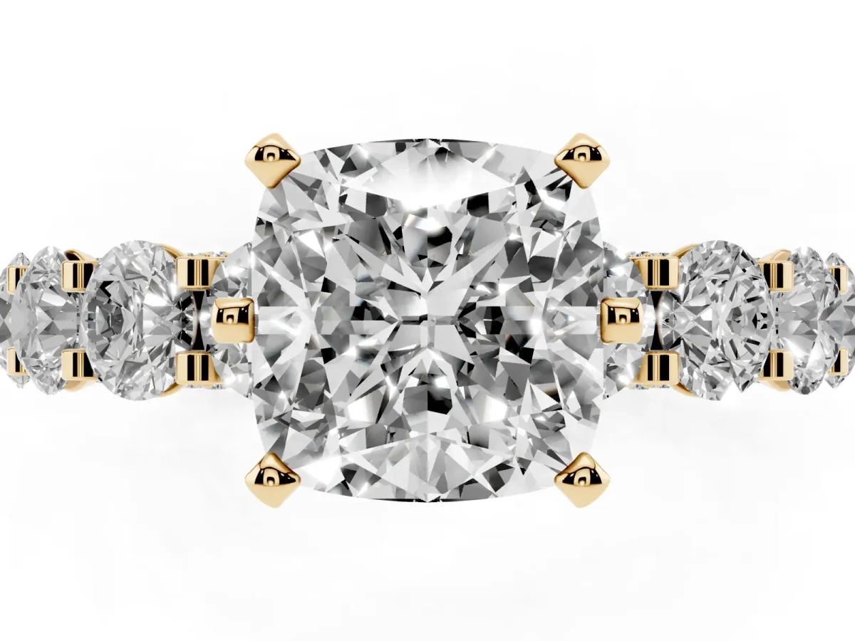 Cushion Cut Diamond Side Stone Engagement Ring with Four-Prong Setting Yellow gold