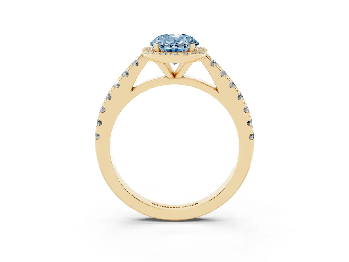 Fancy Blue Oval Cut Cut Halo Diamond Engagement Ring with Pave Band and Four-Prong Setting Yellow gold