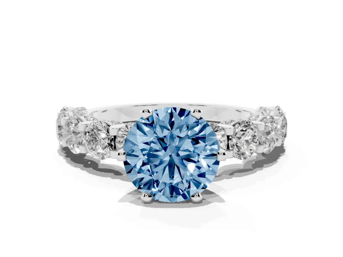 Fancy Blue Round Cut Diamond Side Stone Engagement Ring with Four-Prong Setting Silver