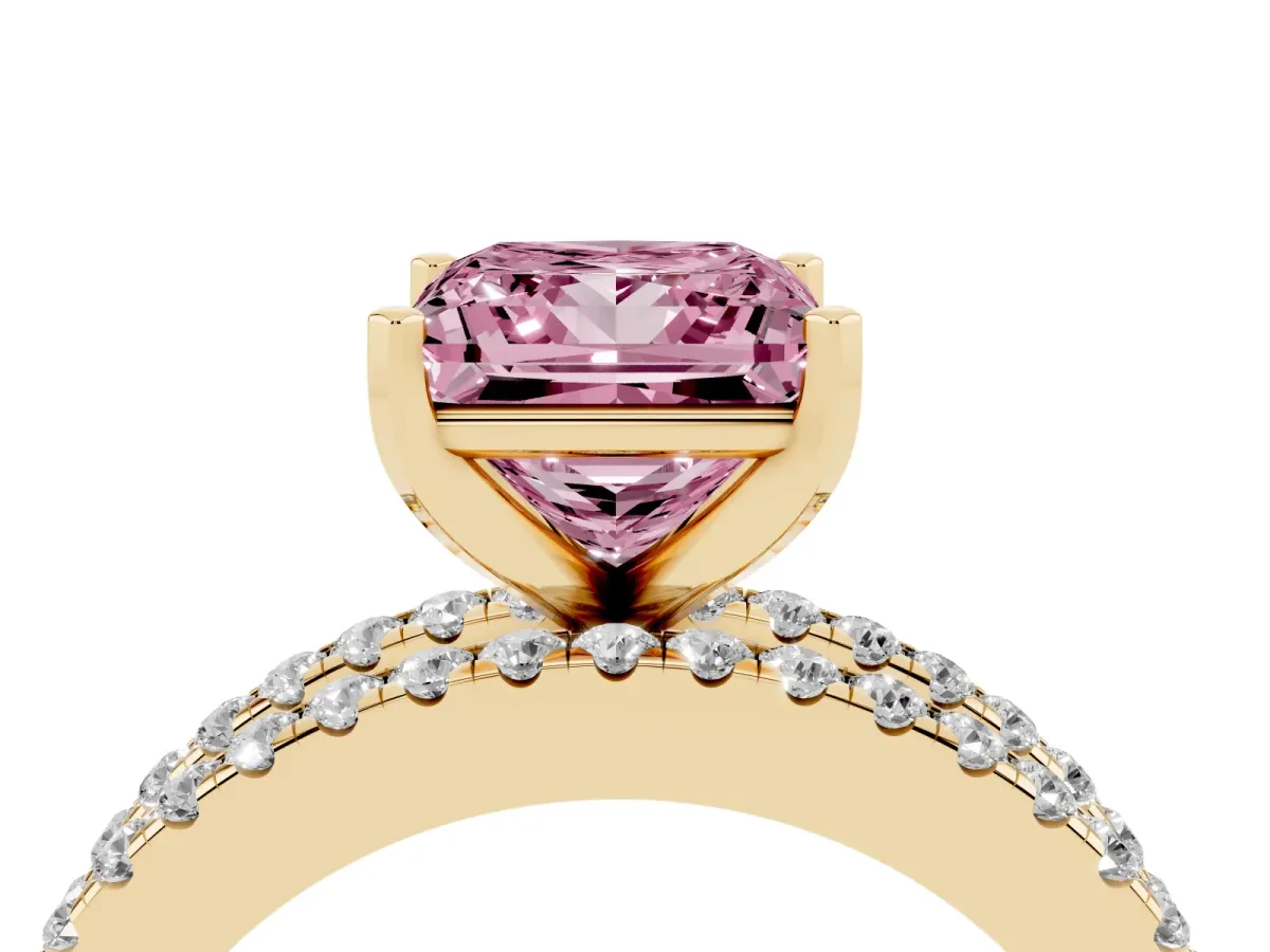 Fancy Pink Princess Cut Diamond Solitaire Ring with Pavé and Channel Set Band Yellow gold