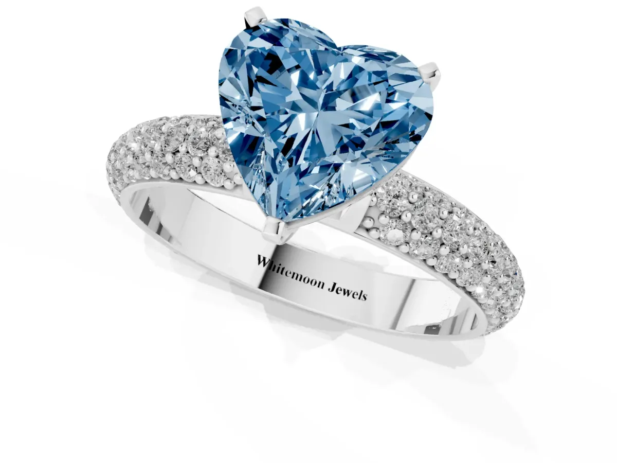 Fancy Blue Heart Cut Diamond Solitaire Ring with Prong Setting and Pavé Band Silver