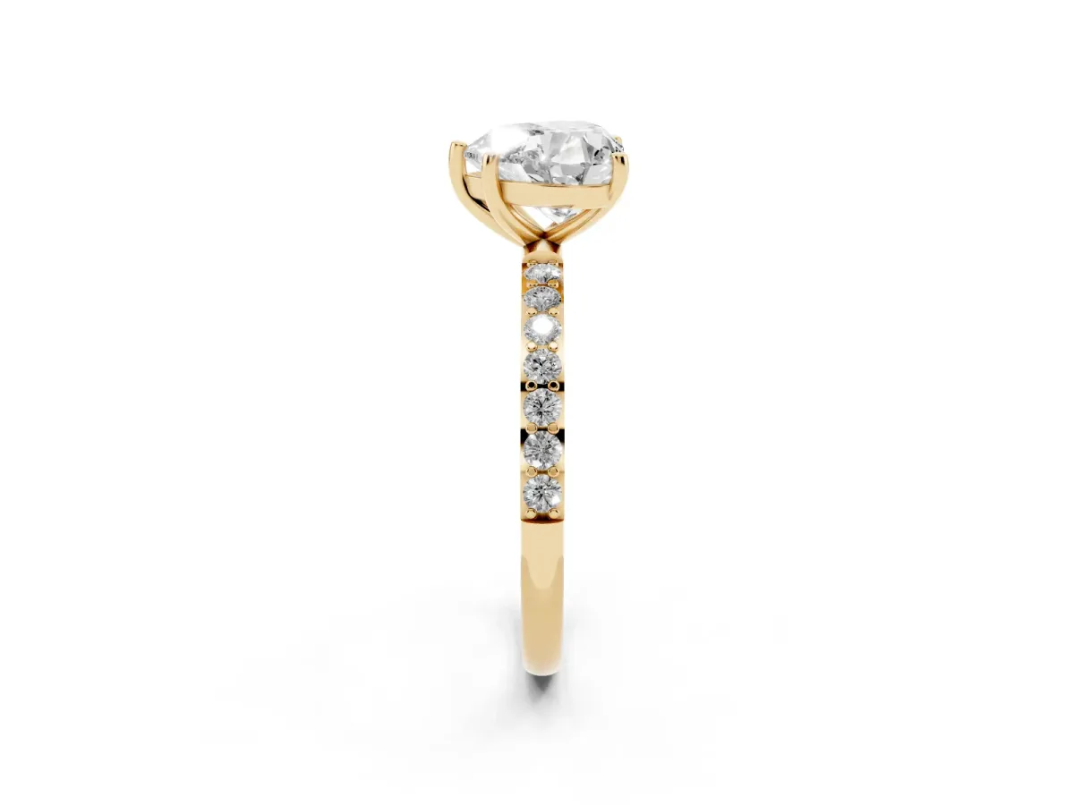 Heart Cut Diamond Solitaire Ring with Round Pavé Shoulders and Prong Setting Yellow gold