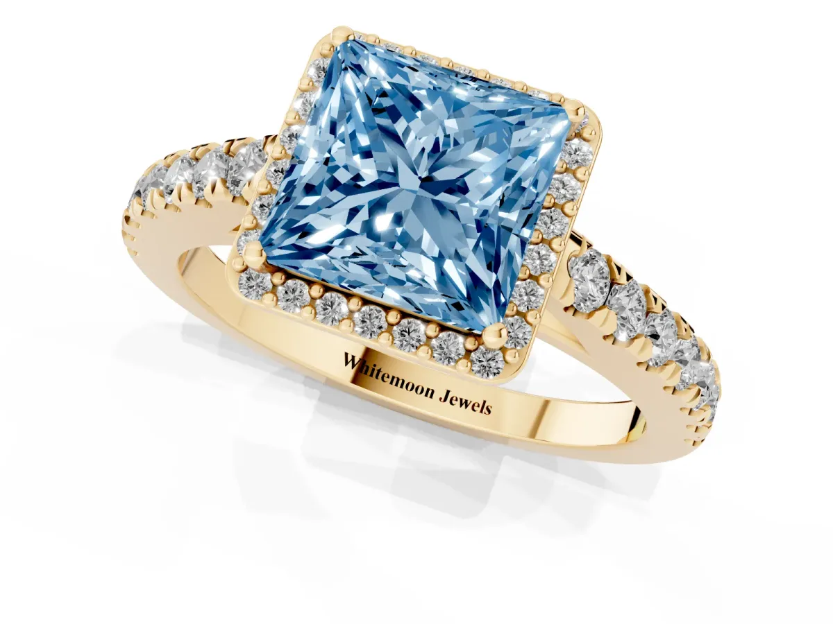 Fancy Blue Princess Cut Cut Halo Diamond Engagement Ring with Pave Band and Four-Prong Setting Yellow gold