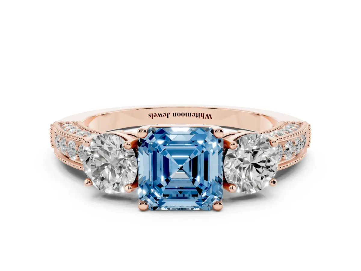 Fancy Blue Asscher Cut Three-Stone Diamond Ring with Pavé Band and Four-Prong Setting Rose gold