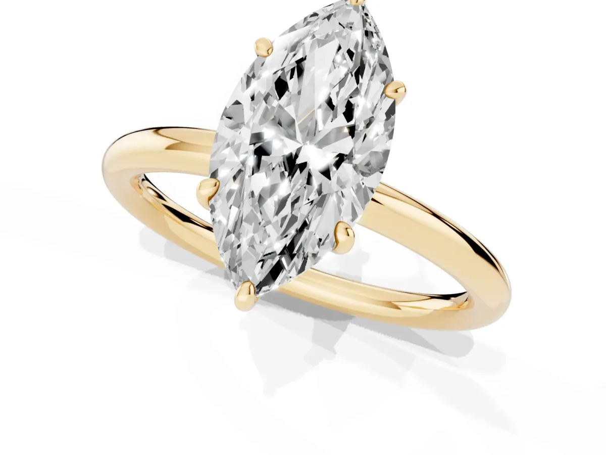 Marquise Cut Solitaire Diamond Ring with Four-Prong Setting on a Plain Band Yellow gold