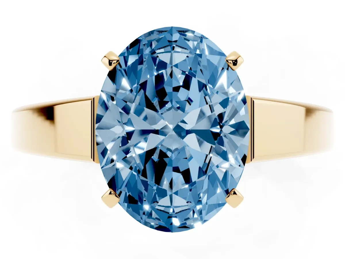 Fancy Blue Oval Cut Solitaire Engagement Ring with Four-Prong Setting and Tapered Band Yellow gold