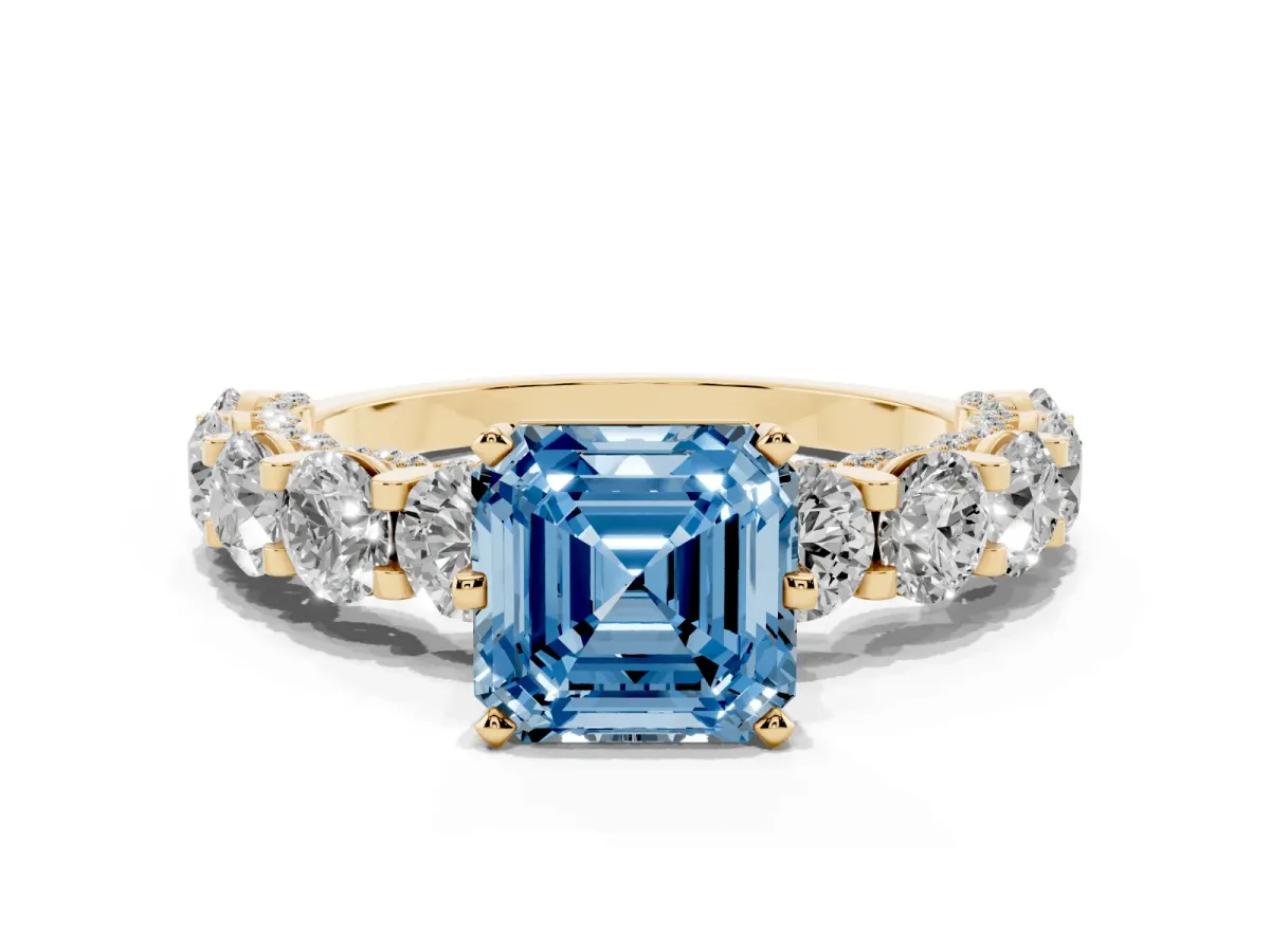Fancy Blue Asscher Cut Diamond Side Stone Engagement Ring with Four-Prong Setting Yellow gold
