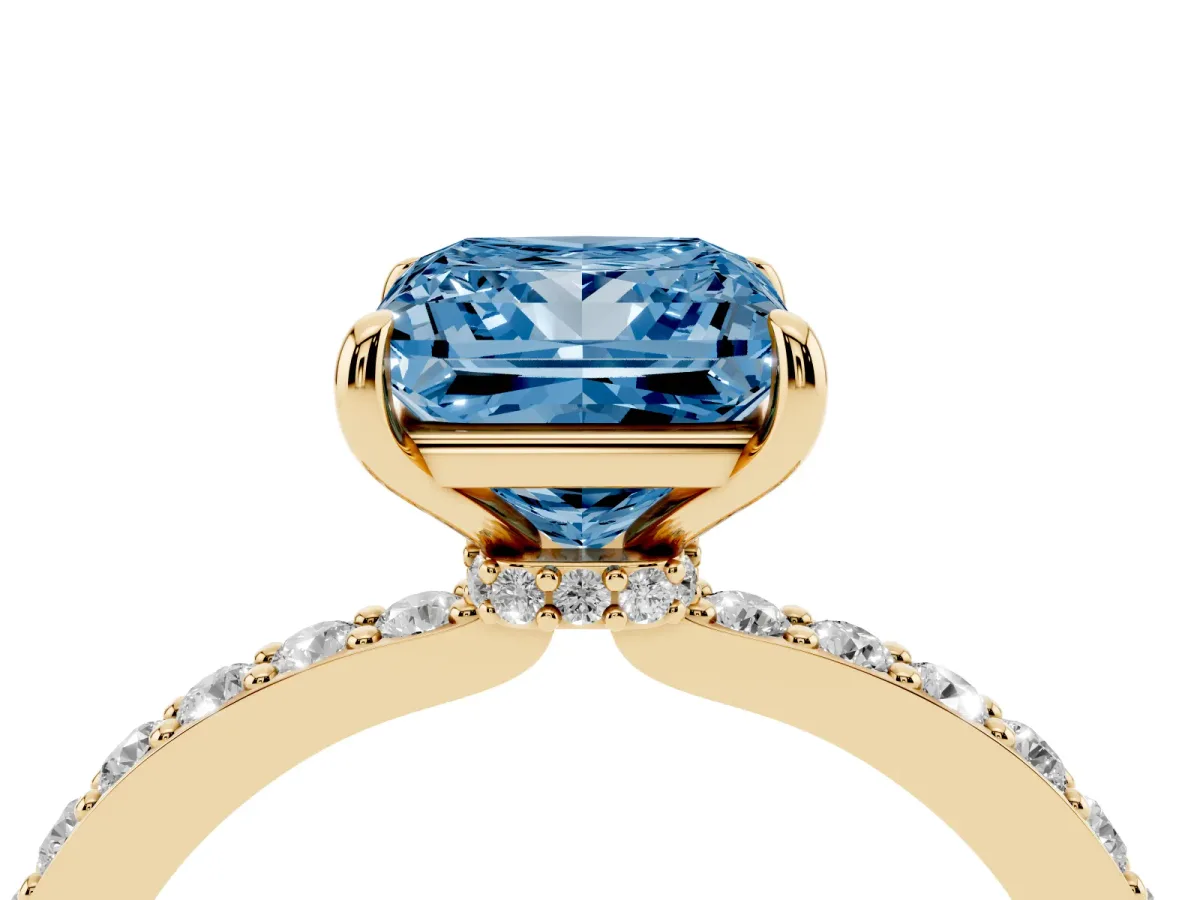 Fancy Blue Princess Cut Diamond Solitaire Engagement Ring with Pavé Band and Four-Prong Setting Yellow gold