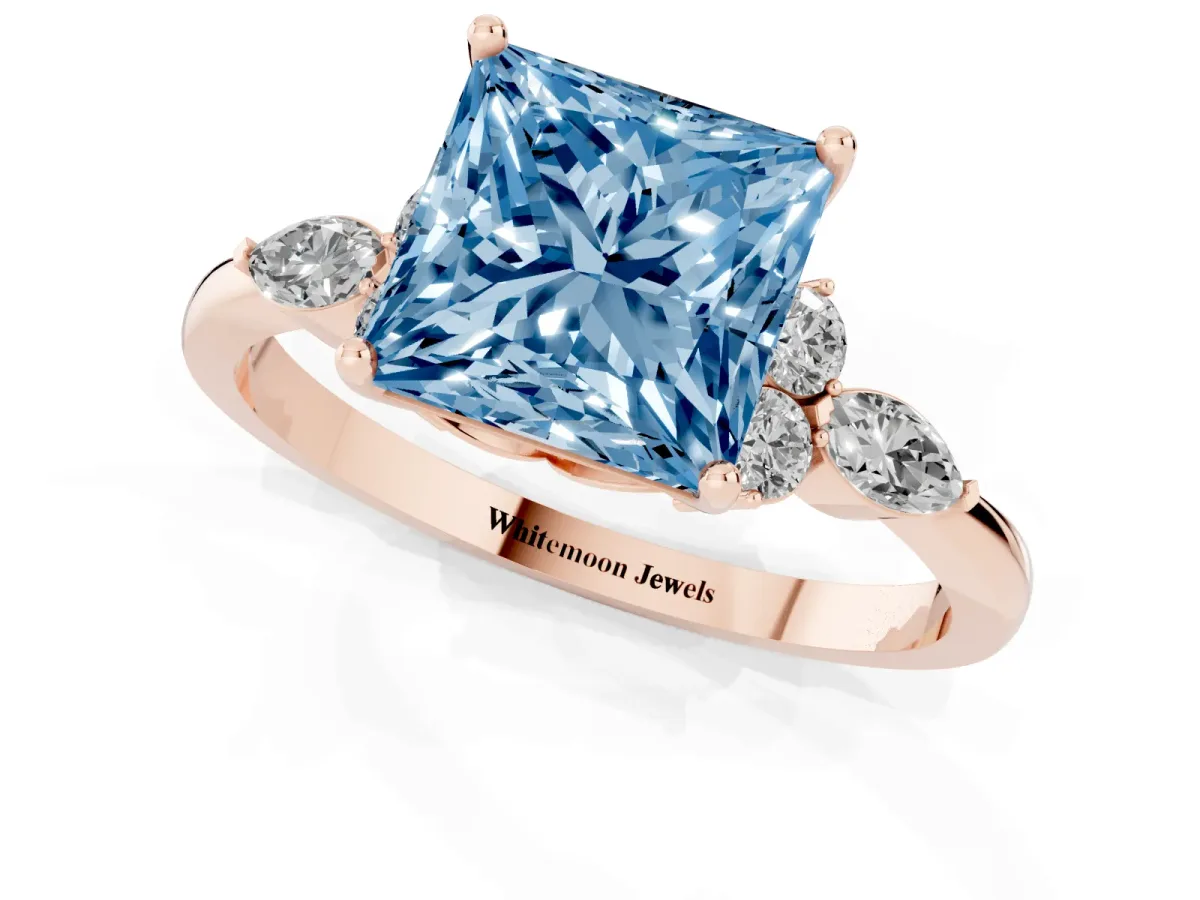 Fancy Blue Princess Cut Brilliant Diamond Solitaire Ring with Pear Side Stones and Four-Prong Setting Rose gold