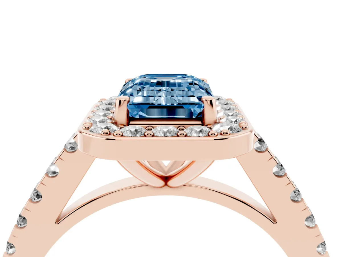 Fancy Blue Emerald Cut Diamond Halo Ring with Round Pavé Split Shank and Prong Setting Rose gold
