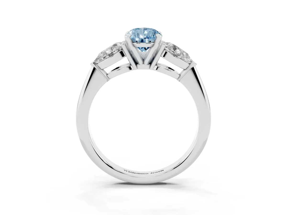 Fancy Blue Three-Stone Pear Cut Diamond Ring with Pear Side Stones and Four-Prong Setting Silver
